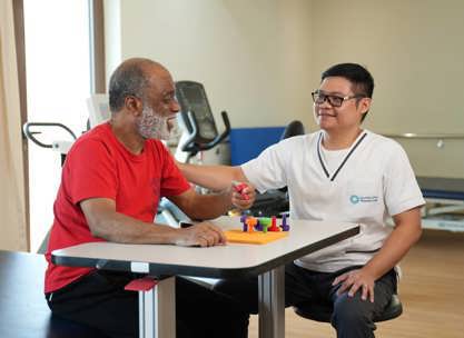 A rehabilitation specialist discussing treatment goals with a patient during Preparation for Inpatient Rehabilitation.